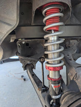 Load image into Gallery viewer, Close-up of Jimmy Has No Garage suspension system with red and silver shock absorber on a vehicle. For 90-05 Mazda Miata Lifted NA NB